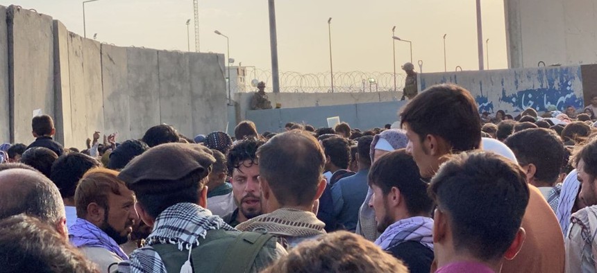 People who want to flee the country continue to wait around Hamid Karzai International Airport in Kabul, Afghanistan on August 24, 2021.