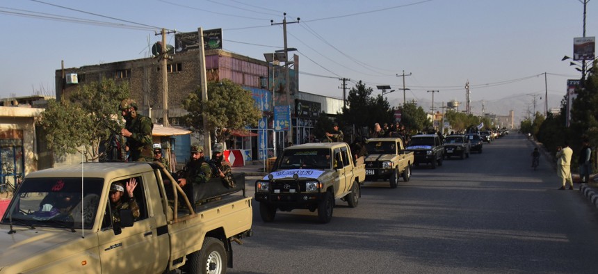 Military vehicles run in Mazar-i-Sharif, capital of northern Balkh province, Afghanistan, Aug. 31, 2021.
