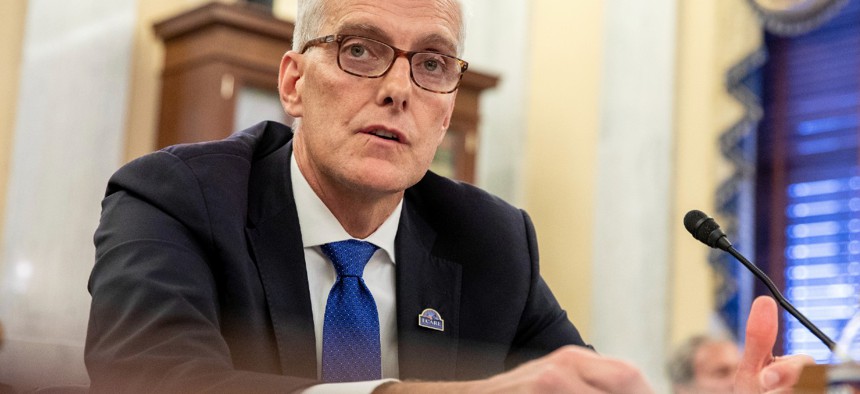 VA Secretary Denis McDonough testifies on Capitol Hill in July. McDonough said Wednesday that VA will be working in the coming weeks to reach those who are unvaccinated or have to make their attestation.