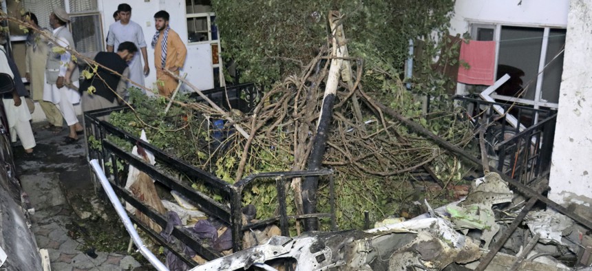 Afghans inspect damage of Ahmadi family house after U.S. drone strike in Kabul, Afghanistan, Aug. 29, 2021. 