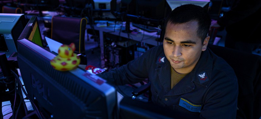 RED SEA (Aug. 25, 2019) Operations Specialist 2nd Class Amulek Moya, assigned to Amphibious Squadron (CPR) 5, stands watch inside the joint operations center aboard amphibious assault ship USS Boxer (LHD 4) during exercise Eager Lion 2019.
