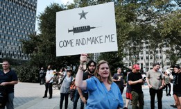 People participate in a rally and march against COVID-19 vaccine mandates on September 13 in New York City. 