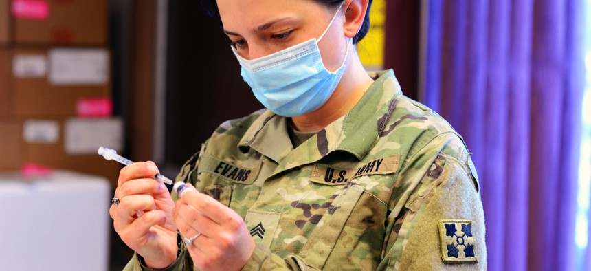 Army Sgt. Morgan Evans, a combat medic specialist, prepares a dose of the Pfizer-BioNTech COVID-19 vaccine at Fort Carson, Colo., Sept. 1, 2021. 