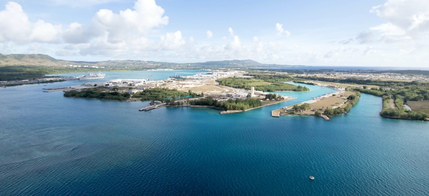 An aerial view of U.S. Naval Base Guam shows several Navy vessels moored in Apra Harbor, March 15. Experts warn that rising sea levels could affect coastal U.S. military bases around the world.