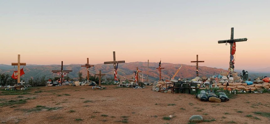 Crosses in honor of fallen Marines stand atop a hill near Camp Pendleton, California. 
