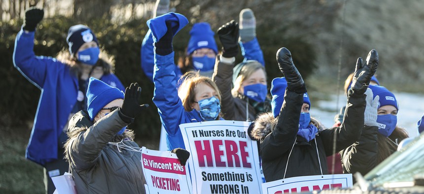 Registered nurses at St. Vincent Hospital in Worcester, Massachusetts, strike against Dallas-based Tenet Healthcare in March.