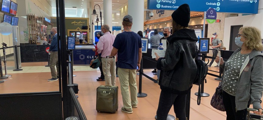 Passengers line up at a TSA security area in West Palm Beach, Florida, last month. 