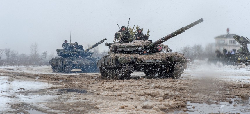 Ukrainian troops of the 92nd Mechanised Brigade use tanks, self-propelled guns, and other armoured vehicles in live-fire exercises near the town of Chuguev, Kharkiv, on Feb 10, 2022.