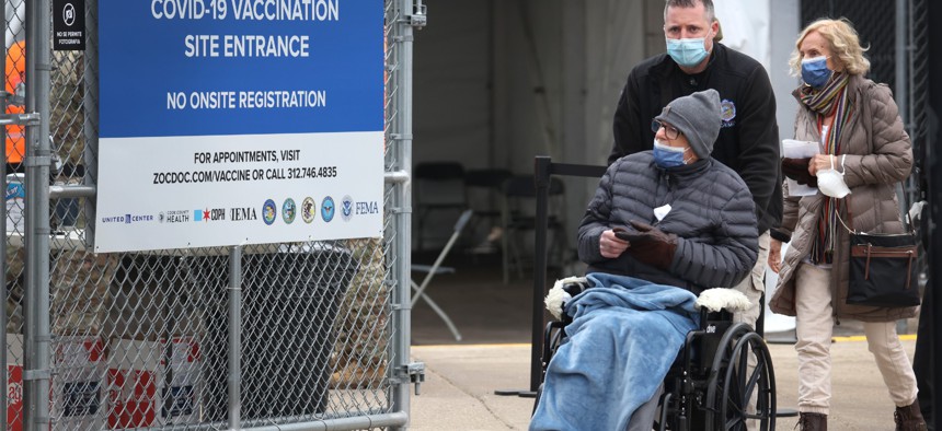 Residents arrive at a mass COVID-19 vaccination center set up in a parking lot outside of the United Center in Chicago in 2021.