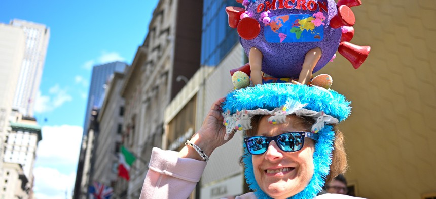 A woman wearing a COVID-19 Omicron bonnet poses at the annual Easter Parade and Bonnet Festival along Fifth Avenue on Easter Sunday on April 17 in New York.