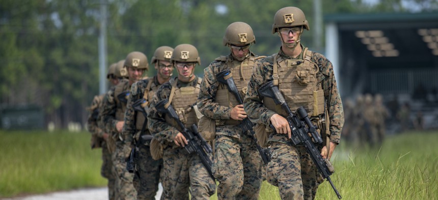 Students with the School of Infantry-East conduct a patrol during the Infantry Marine Course (IMC) on Marine Corps Base Camp Lejeune, North Carolina, July 22, 2021.