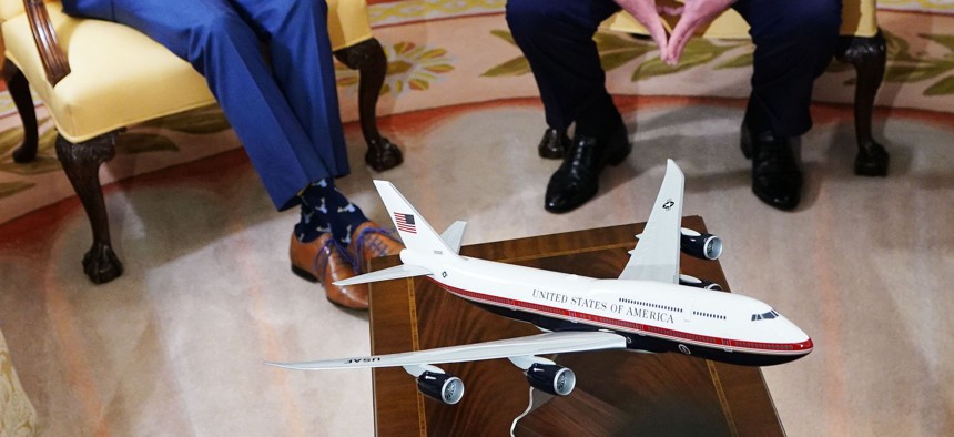 A model of Air Force One with a new color scheme is seen during a bilateral meeting between US President Donald Trump (R) and Canada's Prime Minister Justin Trudeau, June 20, 2019.