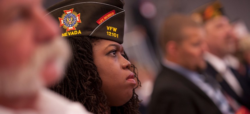 Retired Army Sargeant Vita Lopez, 39, of Nevada listens to US President Barack Obama speak at the 116th National Convention of the Veterans of Foreign Wars (VFW) at the David Lawrence Convention Center on July 21, 2015 in Pittsburgh, Pennsylvania. 