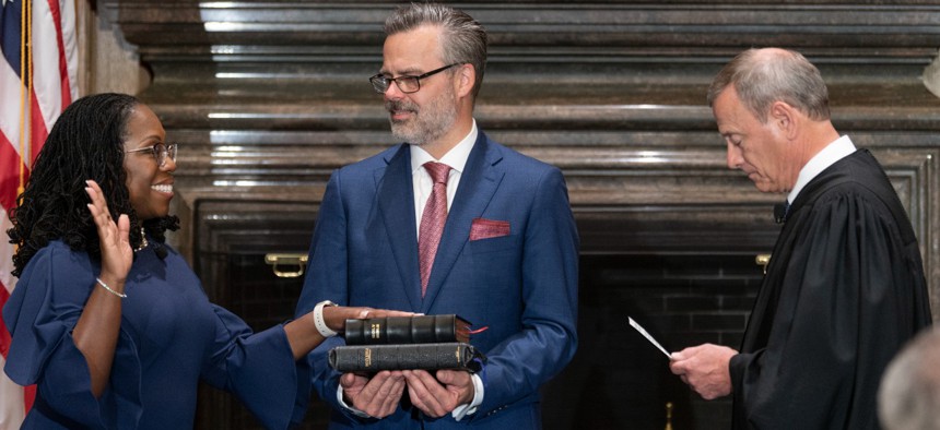 Chief Justice John G. Roberts Jr. (right) administers the Constitutional Oath to Judge Ketanji Brown Jackson in the West Conference Room of the Supreme Court on June 30, 2022 in Washington, D.C. Jackson was sworn in as the newest Supreme Court Justice on Thursday, replacing the now-retired Justice Stephen G. Breyer.