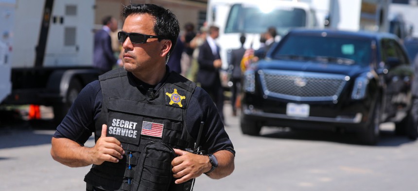 A Secret Service officer stands front of the presidential limousine in Uvalde, Texas, on May 29, 2022. The First Responder Fair RETIRE Act (H.R. 521), was introduced by Reps. Gerry Connolly, D-Va., Brian Fitzpatrick, R-Pa., and Jim Langevin, D-R.I.