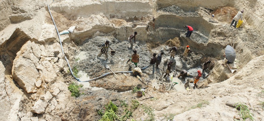 Artisanal miners dig a mining pit in 2013 in Fourona in Côte d’Ivoire.