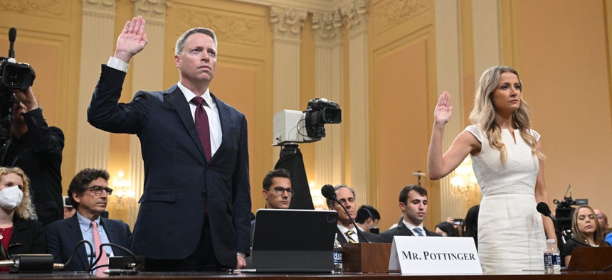 Former deputy national security adviser Matthew Pottinger (L) and Sarah Matthews (R), former deputy White House press secretary, are sworn in before testifying to the House Select Committee to Investigate the January 6th Attack on the U.S. Capitol.