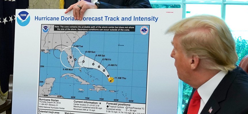 President Trump references a map that appears to have been altered with black marker while talking to reporters following a briefing from officials about Hurricane Dorian in the Oval Office at the White House September 04, 2019. The incident was dubbed "Sharpiegate."