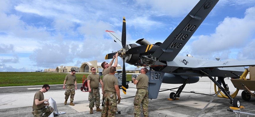 Members of the North Dakota Air National Guard calibrate the propeller of the MQ-9 for a pre-flight check at Andersen Air Force base, Guam, during Exercise Valiant Shield May 27, 2022.