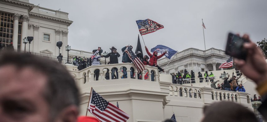 People waving Trump flags overtake the Capitol on Jan. 6, 2021. 