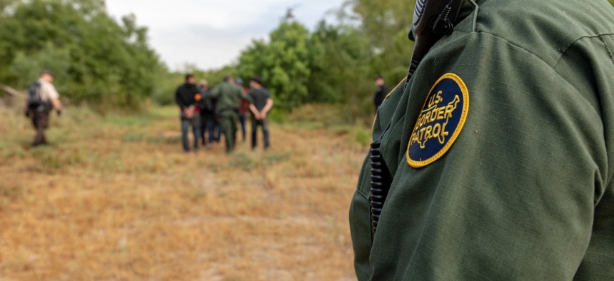 Border Patrol agents assisted by Air and Marine Operations and U.S. Fish and Wildlife Service apprehend migrants who were attempting to illegally enter the U.S. near Penitas, Texas in 2019.