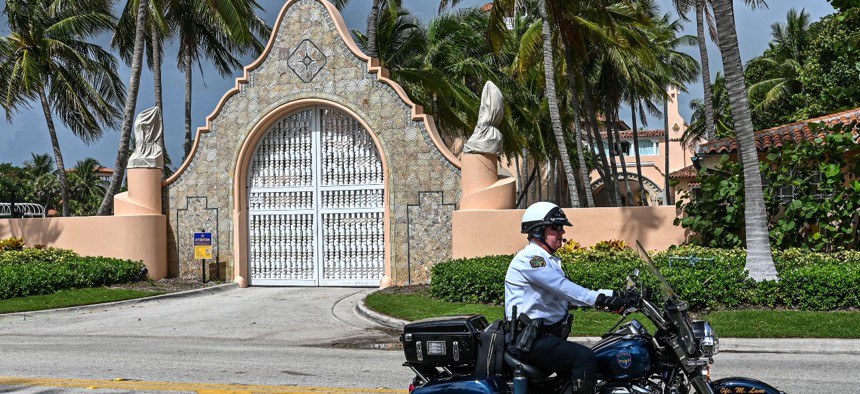 Local law enforcement officers are seen in front of the home of former President Donald Trump at Mar-A-Lago in Palm Beach, Florida. Threats against FBI agents have increased since the FBI searched the former president's home. 