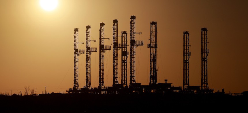 Drilling rigs sit unused on a companies lot located in the Permian Basin area on March 13 in Odessa, Texas