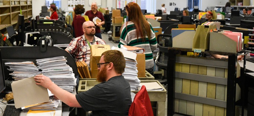 IRS tax examiners at work in the tax agency's Ogden, Utah facility.