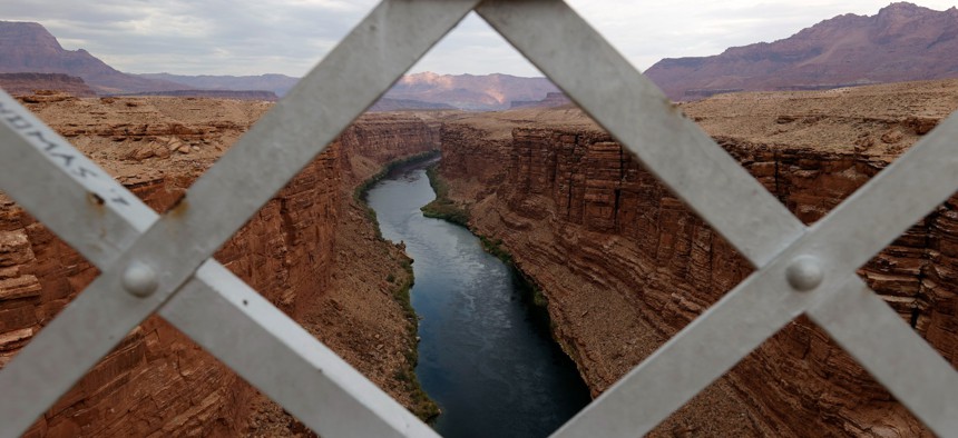 The Colorado River flows under the historic Navajo Bridge in Arizona in 2021.