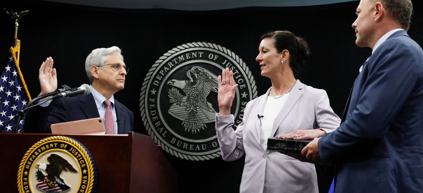 Attorney General Merrick Garland swears in the new Bureau of Prisons Director Colette Peters on Aug. 2. 
