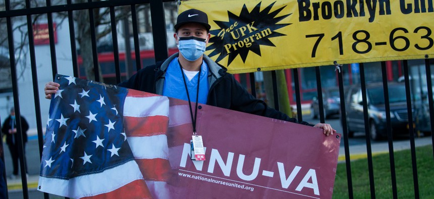 Nurses with the Brooklyn VA Medical Center hold a job action during a shift change on April 6, 2020 in the Brooklyn borough of New York City. Nurses in Brooklyn as well as other locations across the country are now holding rallies to bring attention to staffing shortages. 