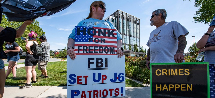 Demonstrators protest the recent actions of the FBI at their Boston headquarters in Chelsea, Massachusetts on August 21, 2022.