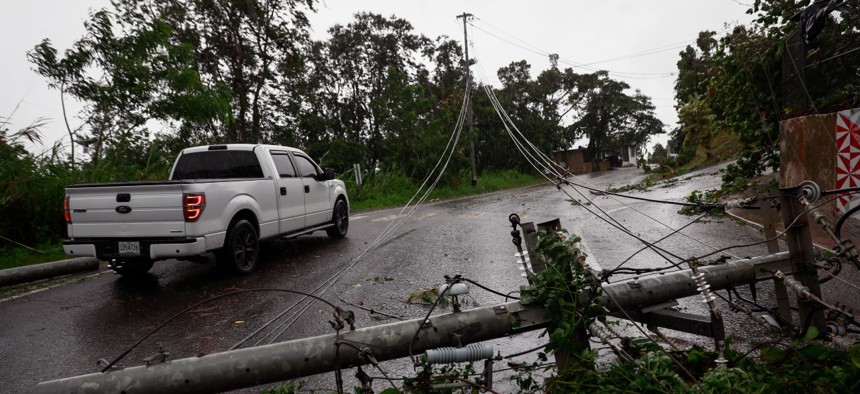 Downed power lines on road PR-743 in Cayey, Puerto Rico as the island awoke to a general power outage on September 19, 2022 in San Juan, Puerto Rico. 