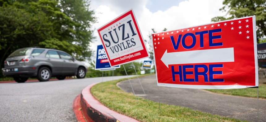  Election signs are seen on election day for the Georgia primary election on May 24 in Atlanta.