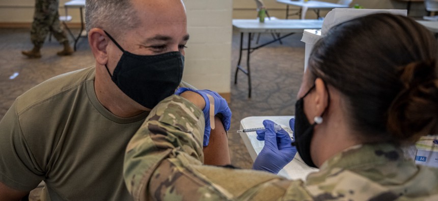 Maj. Eric Korpi, a human resource officer with Joint Task Force Headquarters, Hawaii National Guard Joint Task Force received the Pfizer-BioNTech vaccine on October 1, 2021, at the Hawaii Army Readiness Center, Kalaeloa, Hawaii.