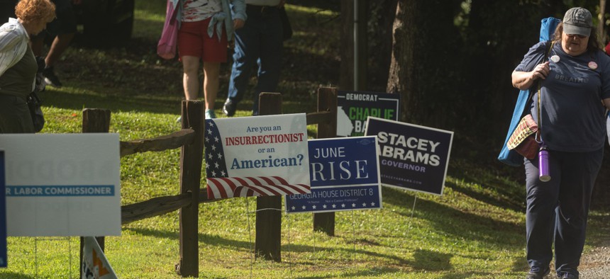 Political signs stand by the road in Clayton, Georgia in July.