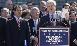Newt Gingrich holds up a copy of the Contract With America at a ceremony marking the GOP's first 100 days in control of the House in 1995.