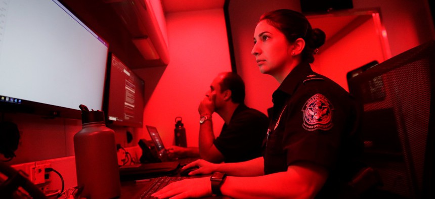 U.S. Customs and Border Protection officers with the Office of Field Operations conduct oversight operations at the Region IV Emergency Operations Center in Doral, Fla., on Sept. 29.