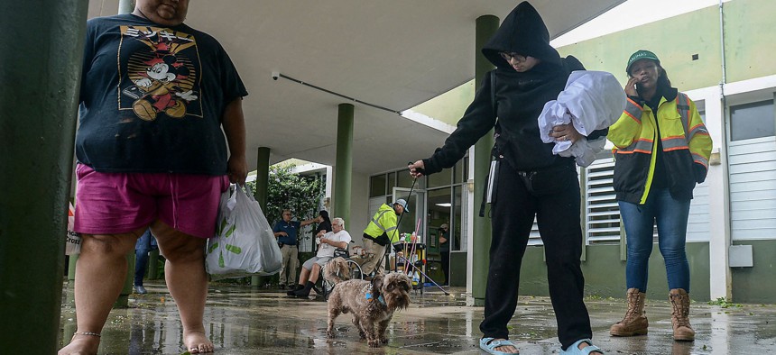  People arrive at a shelter after the passage of hurricane Fiona in Salinas, Puerto Rico, on September 19.