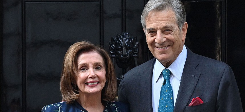 Nancy Pelosi and her husband Paul Pelosi pose for the media in London in 2021.