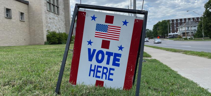A sign at the Campus Lutheran Church in Columbia, Mo., tells residents where to vote on the primary election on Aug. 2, 2022 