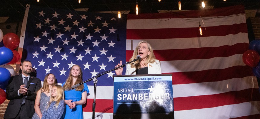 Rep. Abigail Spanberger, D-Va., celebrates after winning reelection on November 8, 2022 in Fredericksburg, Va. A former CIA employee, Spanberger’s first bill was to ensure back pay for federal workers.