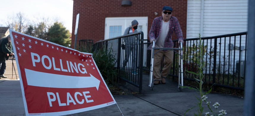 Voters leave their polling place in Lancaster County, Pennsylvania, after casting their ballots in the midterm elections on November 8.