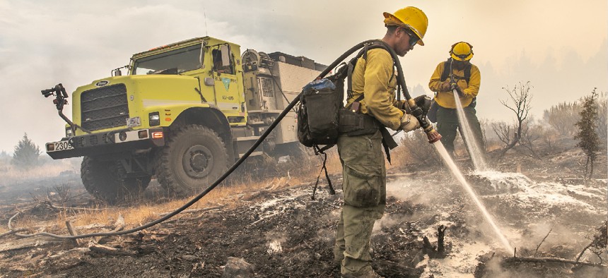 Engine crew members mopping up spot fires on the Bureau of Land Management's Trout Springs Prescribed Fire in southwest Idaho in 2019.