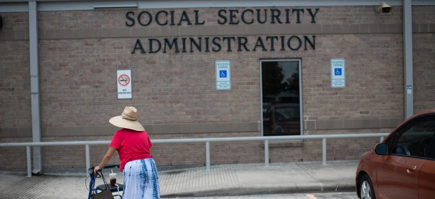 A woman walks into a Social Security office in Houston, Texas on July 13, 2022. 