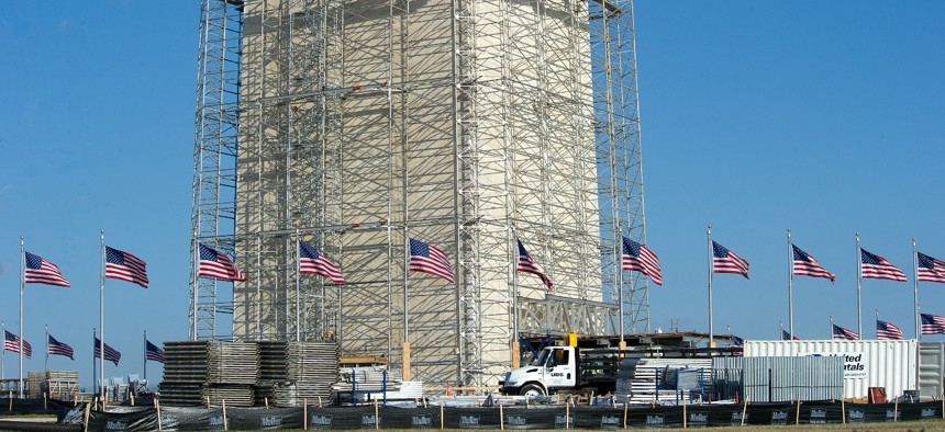 Workers erect scaffolding around the Washington Monument on March 13, 2013. The scaffolding is being put in place so that repairs can be made to the monument after it was damaged in an earthquake in 2011.