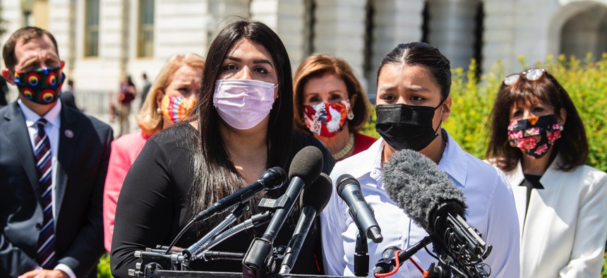 The sisters of Vanessa Guillen—Lupe, right, and Mayra—speak during a news conference outside the Capitol about legislation to allow military victims of sexual harassment and assault to report incidents outside the chain of command on May 13, 2021.
