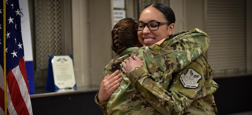 U.S. Army Maj. Darla Deauvearo, left, hugs her daughter 2nd Lt. Jasmine Scott, Aug. 10, 2018, after she read her the oath of office during a commissioning ceremony at Whiteman Air Force Base in 2018.