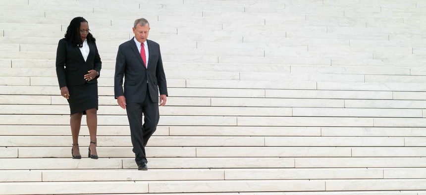 Associate Justice Ketanji Brown Jackson is walks at the Supreme Court with Chief Justice John Roberts in September.