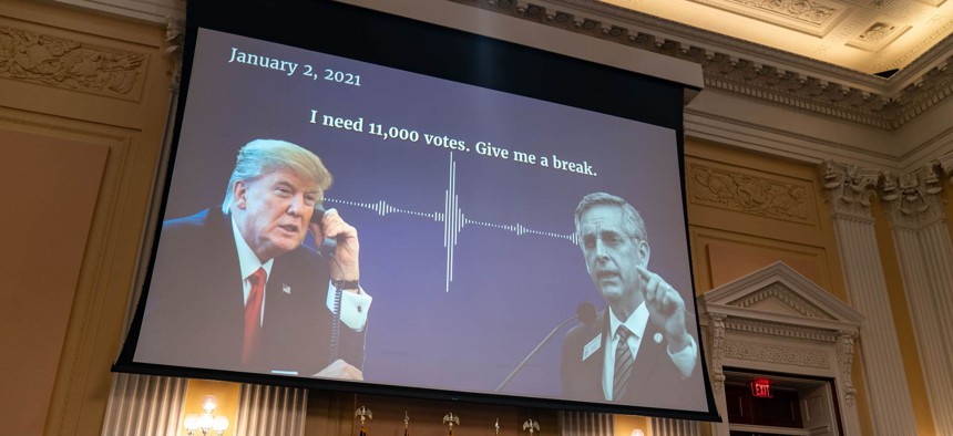 A digital presentation of President Donald Trump speaking with Georgia Secretary of State Brad Raffensperger on Monday during the hearing.